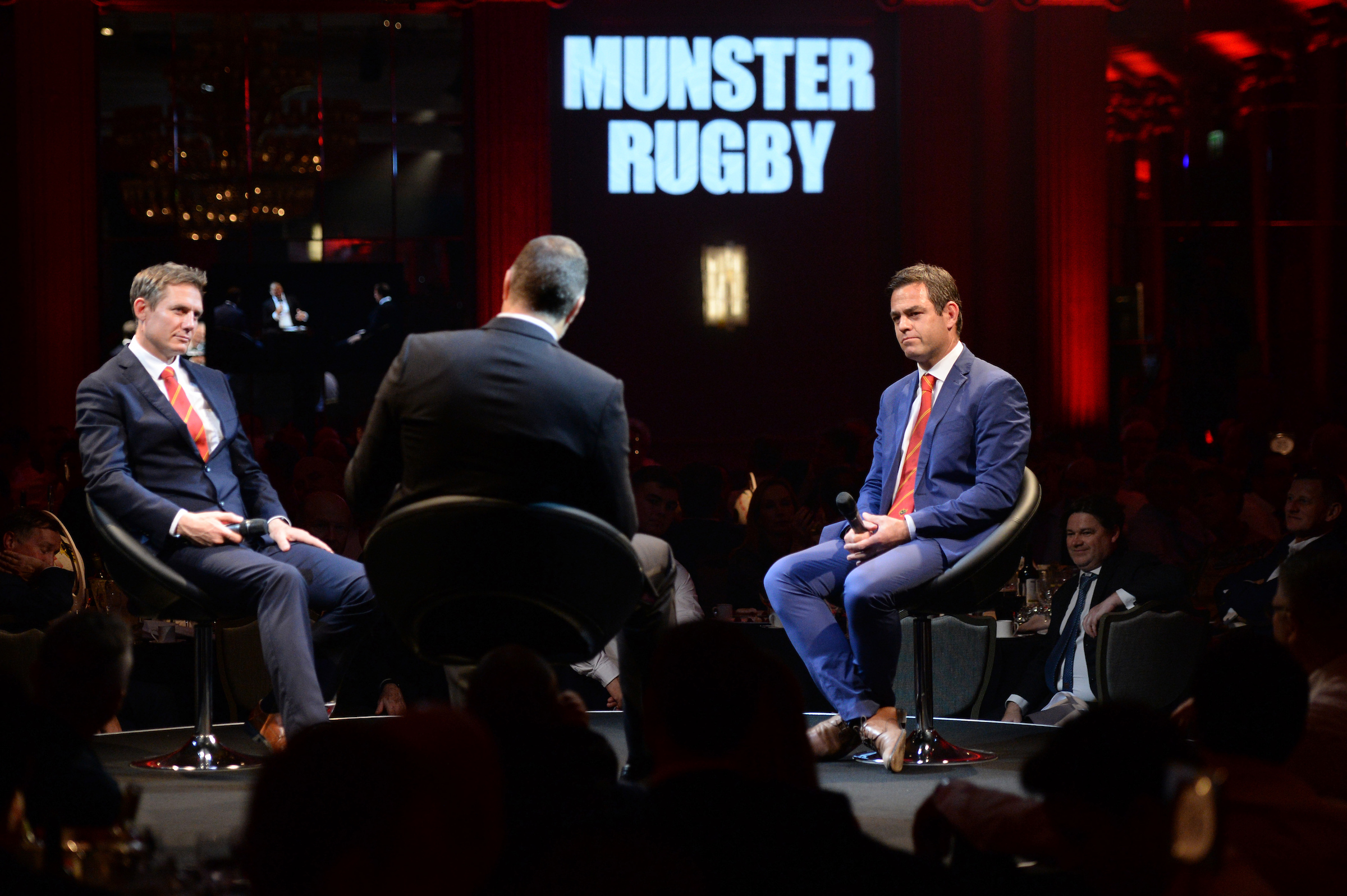 Stephen Larkham and Johann van Graan on stage with Martin Bayfield.