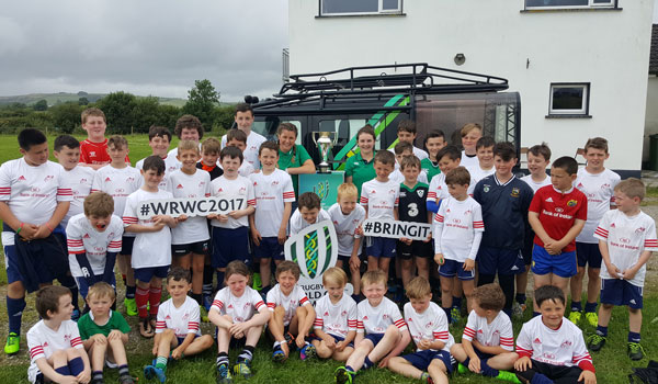Anna Caplice and Liz Burke bring the Women's World Cup trophy to the Munster Rugby Summer Camp in Scariff