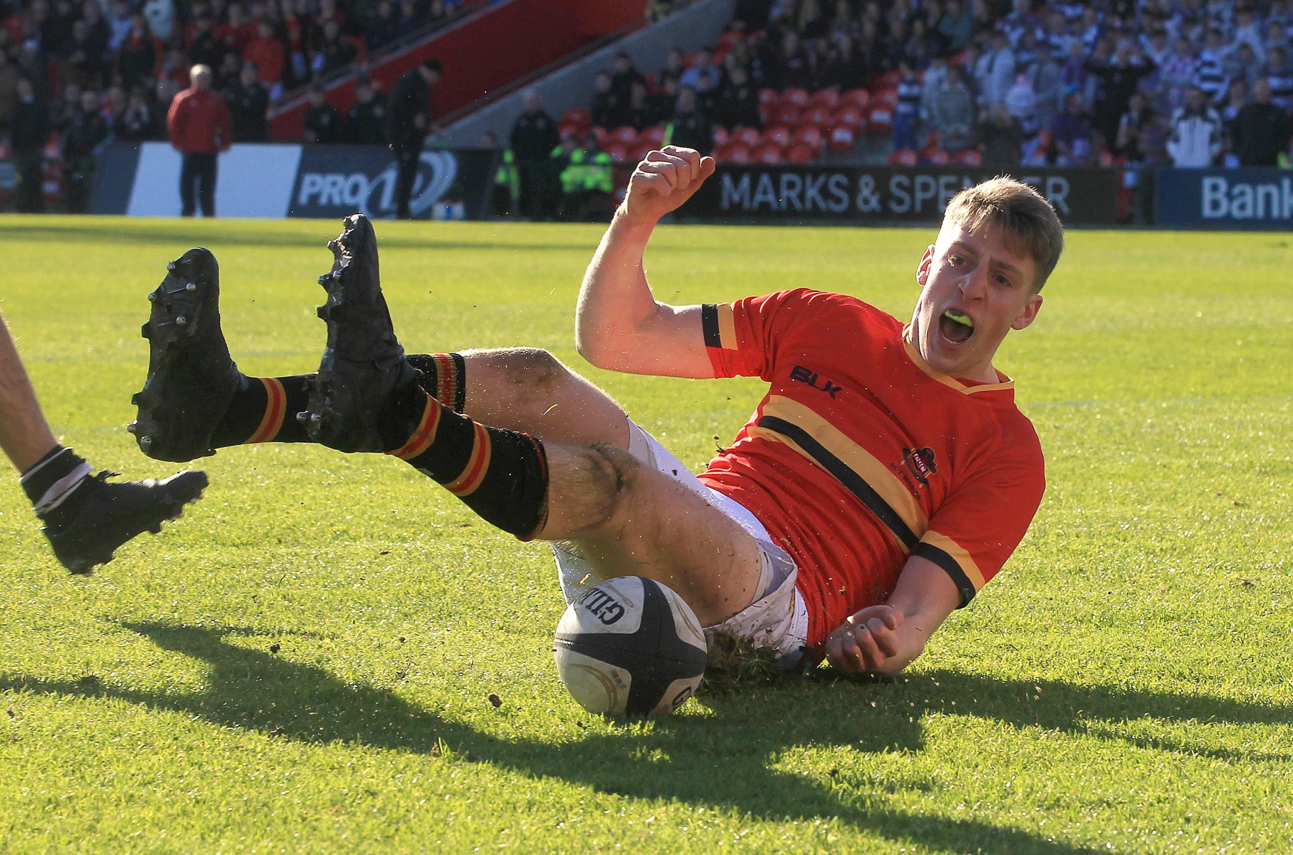 Liam Coombes celebrates scoring a try for CBC in 2016.