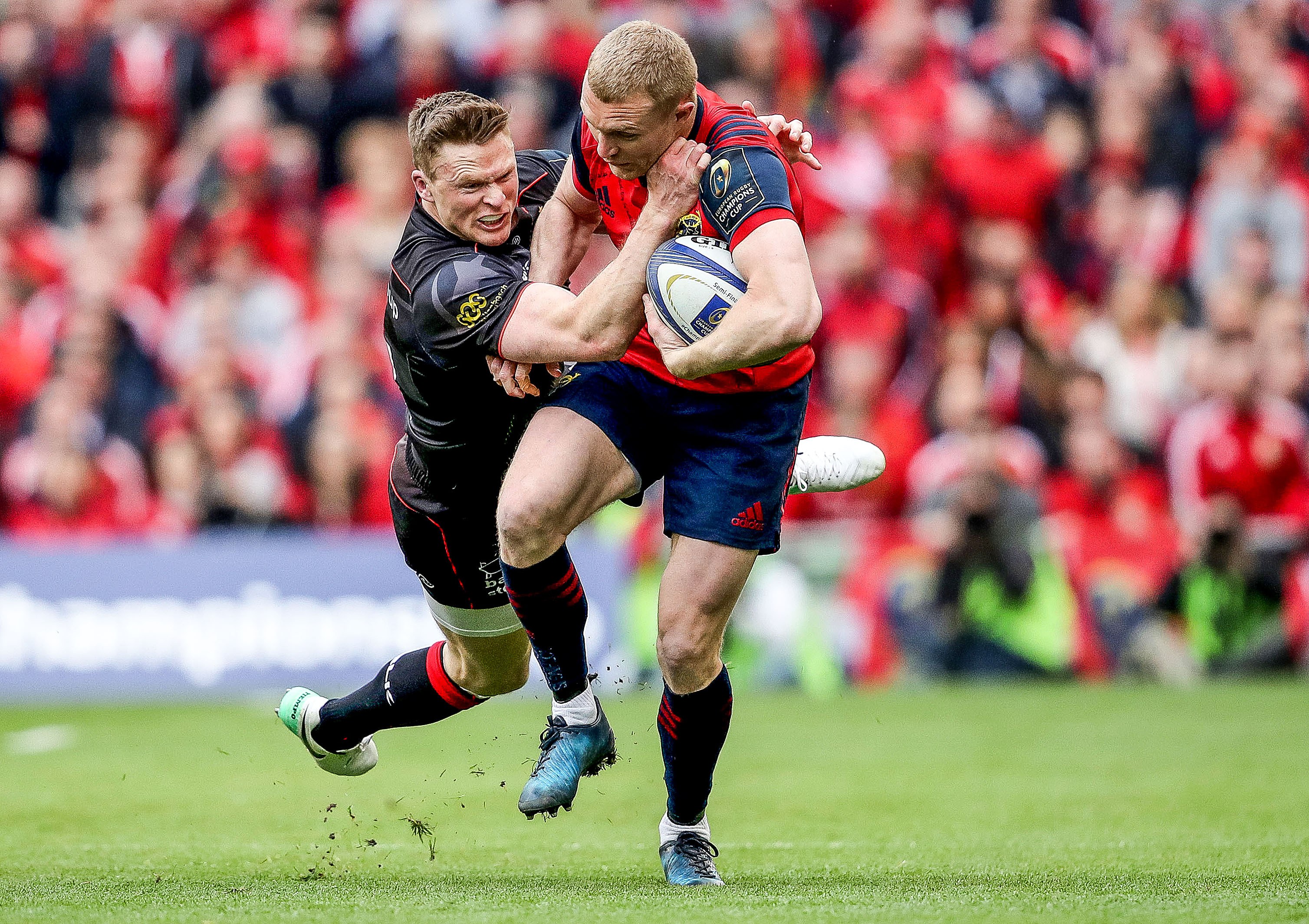 Keith Earls ties to break the tackle of Ashton.