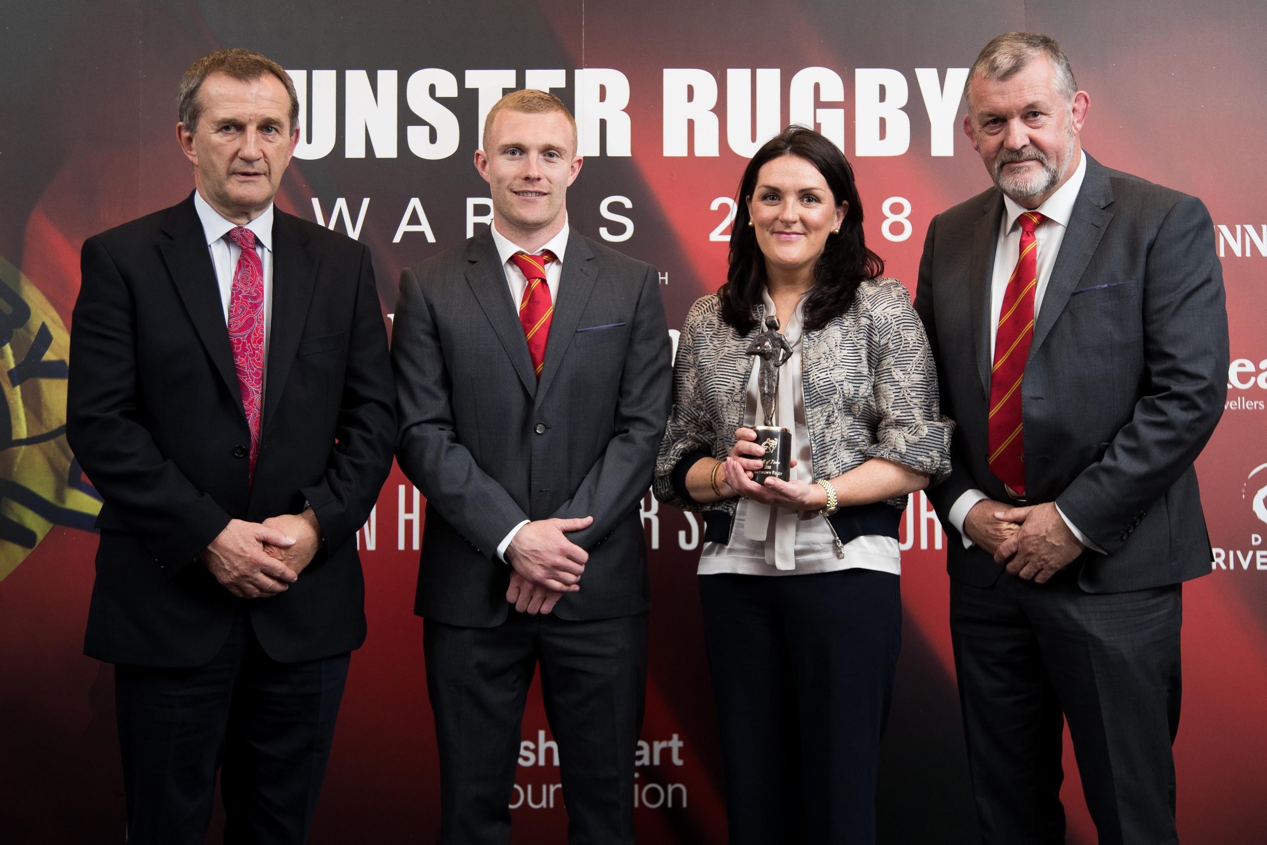 Former Munster Rugby CEO Garrett Fitzgerald, Keith Earls and Team Manager Niall O'Donovan present Olive Foley on behalf of Anthony Foley with the Hall Of Fame Award in 2018.
