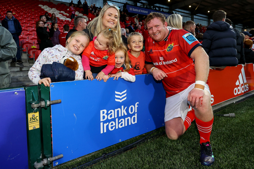 Stephen Archer celebrates after the game with his family after winning his 250th cap for Munster in 2022.