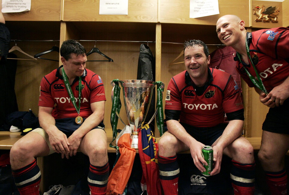 David Wallace, Anthony Foley and Peter Stringer in the changing room with the trophy.
