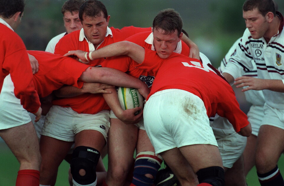 Peter Clohessy and Mick Galwey of Munster shield the ball against Swansea in 1995