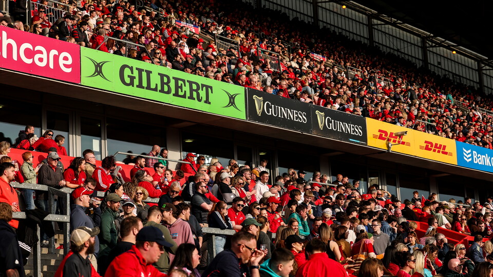 A vew of supporters and signage in Thomond Park