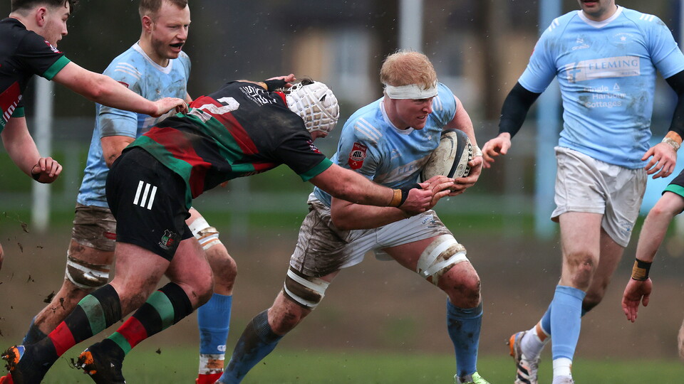 Highfield's Travis Coomey tackles Des Fitzgerald of Garryowens ©INPHO