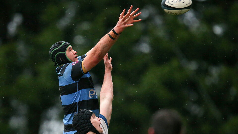 Cork Constitution's Richard Thompson challenges Christian Storey of Shannon for a line ball ©INPHO