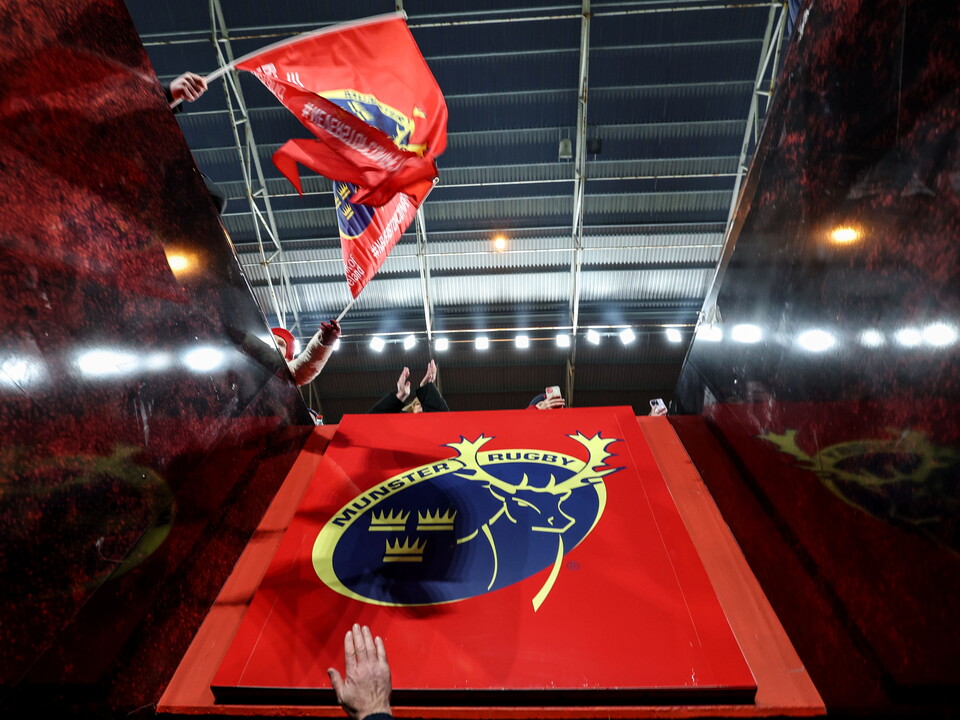 Red flag drops onto a red carpet with the blue and yellow logo of the Norwegian football team.