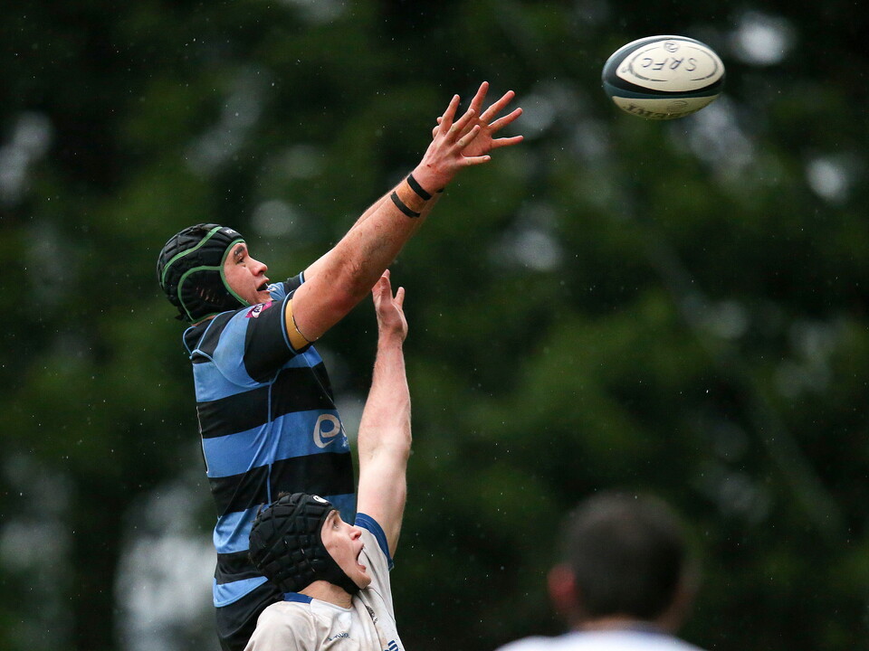 Cork Constitution's Richard Thompson challenges Christian Storey of Shannon for a line ball ©INPHO