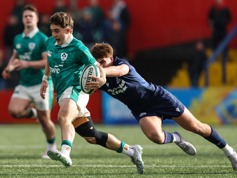 Ireland's Christopher Barrett is tackled by Harry Clark of Scotland ©INPHO